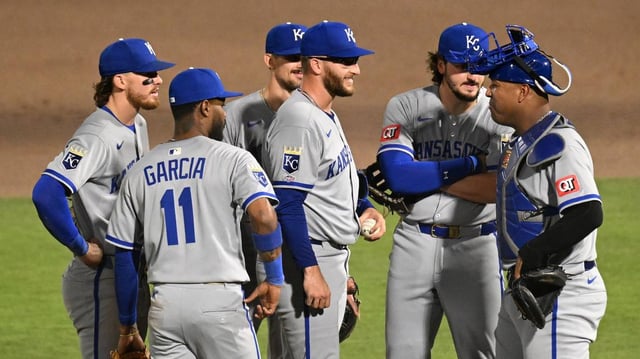 Kansas City Royals starting pitcher Noah Cameron (65) reacts as his teammates join him on the mound after he gave up his first hit of the night in the seventh inning against the Tampa Bay Rays at George M. Steinbrenner Field on April 30, 2025 in Tampa, Florida.