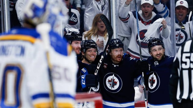 Apr 30, 2025; Winnipeg, Manitoba, CAN; Winnipeg Jets forward Vladislav Namestnikov (7) is congratulated by his teammates on his goal against the St. Louis Blues during the second period in game five of the first round of the 2025 Stanley Cup Playoffs at Canada Life Centre. Mandatory Credit: Terrence Lee-Imagn Images
