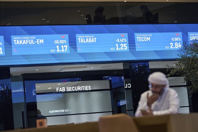 FILE - An Emirati man is seen in the Dubai Financial Market in Dubai, United Arab Emirates, Monday, April 7, 2025. (AP Photos/Fatima Shbair, File)