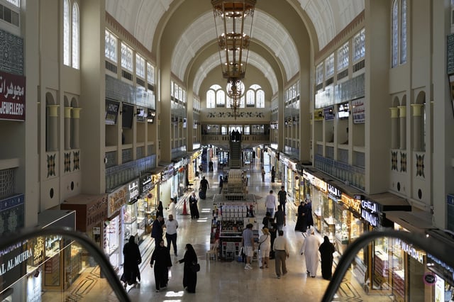 FILE - People shop for gold at a jewelry market in Dubai, United Arab Emirates, Wednesday, April 9, 2025. (AP Photo/Altaf Qadri, File)