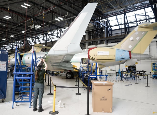 A Bombardier employee works on an aircraft in Dorval, Quebec on Monday, April 14, 2025. Bombardier Inc. reported a first-quarter profit of US$44 million, down from US$110 million a year earlier as its revenue rose. THE CANADIAN PRESS/Christinne Muschi