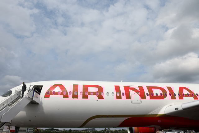 Branding for Air India is seen on an Airbus A350-900 at the Farnborough International Airshow, in Farnborough, Britain, July 24, 2024. REUTERS/Toby Melville/File Photo