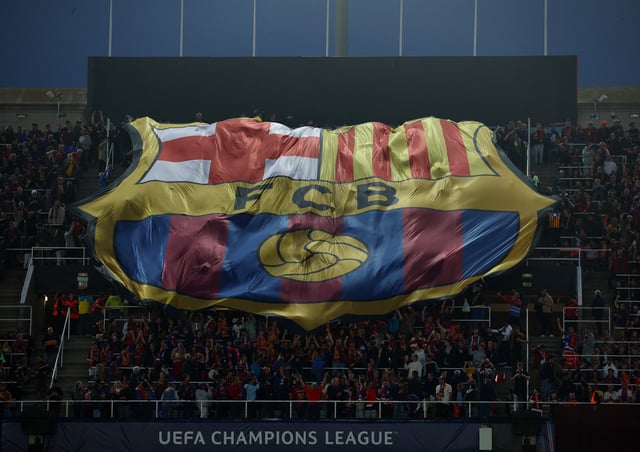 Soccer Football - Champions League - Semi Final - First Leg - FC Barcelona v Inter Milan - Estadi Olimpic Lluis Companys, Barcelona, Spain - April 30, 2025 FC Barcelona fans with a giant banner inside the stadium before the match REUTERS/Albert Gea