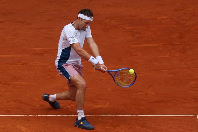 Norway's Casper Ruud returns the ball to Russia's Daniil Medvedev during the quarter-final clash