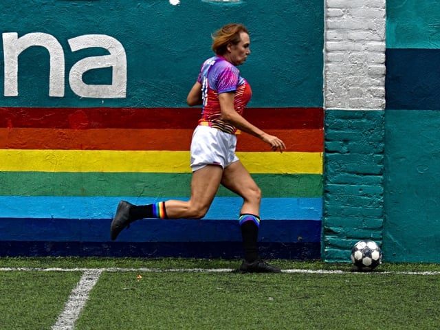 Chicas Trans' player Noemi Arzate Miranda controls the ball during a football match in Azcapotzalco borough, Mexico City, on June 23, 2024. In a fight against machismo, mockery, and morbidity, Mexican transgender female football players, wearing flashy jackets and colorful hair, take to the field for the conquest of the rights of the LGBT community. (Photo by Haaron ALVAREZ / AFP)