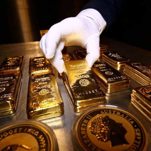 Gold bars and coins are stacked in the safe deposit boxes room of the Pro Aurum gold house in Munich, Germany,  August 14, 2019.