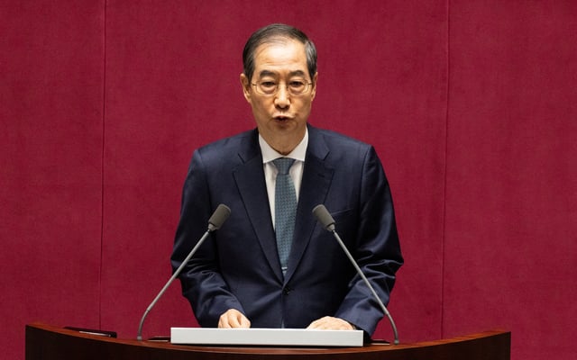 Acting president Han Duck-soo gives a speech on the government budget at the National Assembly in Seoul, South Korea, 24 April 2025. JEON HEON-KYUN/Pool via REUTERS