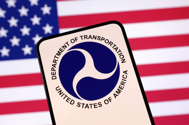 United States Department of Transportation logo and U.S. flag are seen in this illustration taken April 23, 2025. REUTERS/Dado Ruvic/Illustration