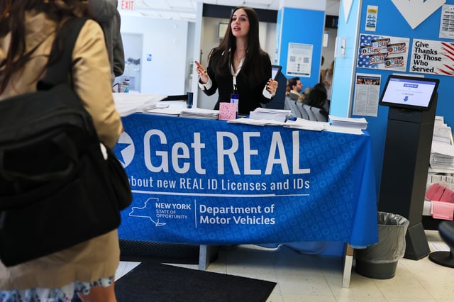 An employee checks people in at the New York State DMV on April 28, 2025 in New York City.