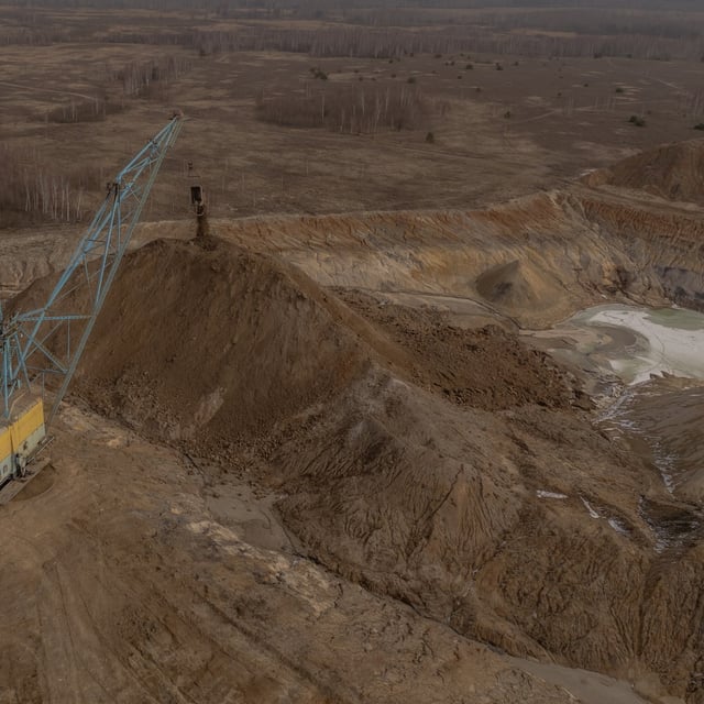 (FILES) An aerial view shows a dragline excavator operating in an open-pit titanium mine in the Zhytomyr region, on February 28, 2025, amid the Russian invasion of Ukraine. The United States and Ukraine on April 30, 2025 signed a minerals deal after a two-month delay, in what President Donald Trump's administration called a new form of US commitment to Kyiv after the end of military aid. Ukraine said it secured key interests after protracted negotiations, including full sovereignty over its own rare earths, which are vital for new technologies and largely untapped. (Photo by Roman PILIPEY / AFP) (Photo by ROMAN PILIPEY/AFP via Getty Images)
