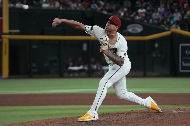Apr 27, 2025; Phoenix, Arizona, USA; Arizona Diamondbacks pitcher Justin Martinez (63) throws against the Atlanta Braves in the ninth inning at Chase Field. Mandatory Credit: Rick Scuteri-Imagn Images/File Photo