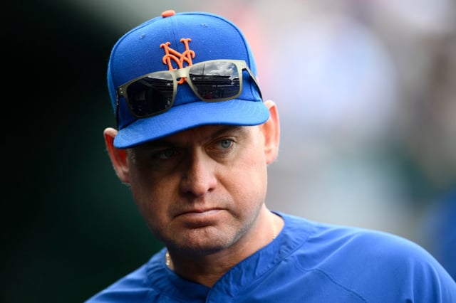 New York Mets manager Carlos Mendoza (64) looks on before a baseball game against the Washington Nationals, Saturday, April 26, 2025, in Washington. (AP Photo/Nick Wass)
