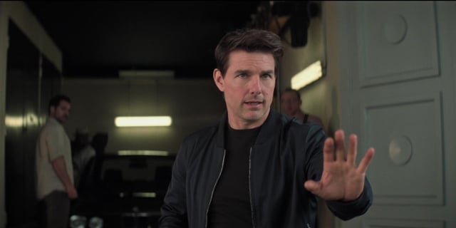Ethan Hunt (Tom Cruise) attempts to reason with a police officer in Paris after blowing his cover in 'Mission: Impossible - Fallout'