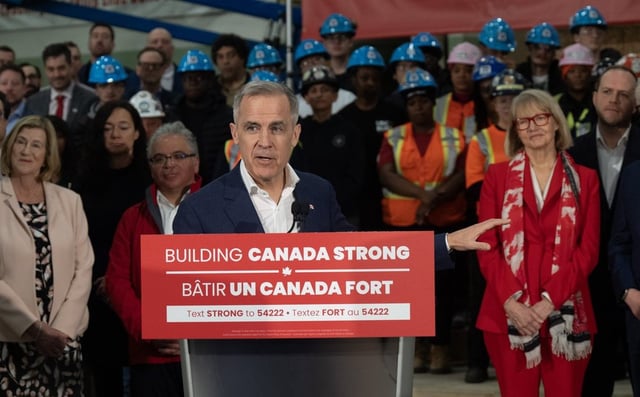 Liberal Leader Mark Carney gestures to candidates as he makes a campaign stop at the College of Carpenters and Allied Trades on Monday, March 31, 2025 in Vaughan, Ont. THE CANADIAN PRESS/Adrian Wyld