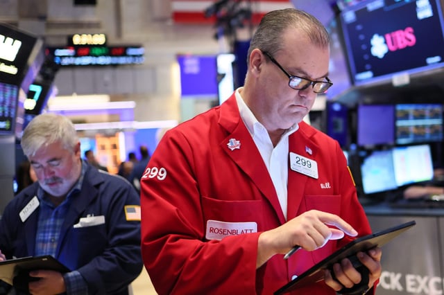A trader works the floor on the New York Stock Exchange Wednesday, April 30.