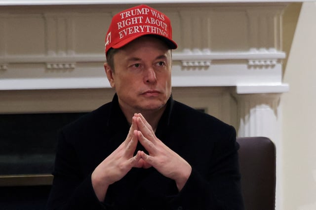 Tesla CEO Elon Musk wears a 'Trump Was Right About Everything!' hat while attending a cabinet meeting at the White House, in Washington, D.C., U.S., March 24, 2025. REUTERS/Carlos Barria/File Photo