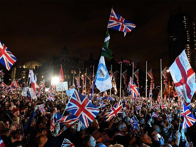  Brexit supporters wave Union flags as they gathered in Parliament Square, the venue for the Leave Means Leave Brexit Celebration in central London on Jan. 31, 2020, the day that the UK formally left the European Union.