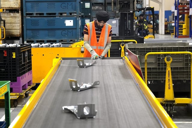 An employee works on the production line at the Martinrea auto parts manufacturing plant, in Woodbridge, Ont., on Monday February 3, 2025. The site supplies auto parts to both Canadian and US auto plants. THE CANADIAN PRESS/Chris Young