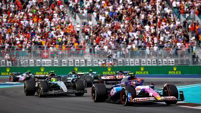 Yuki Tsunoda of Japan driving the (22) Visa Cash App RB VCARB 01 leads Lewis Hamilton of Great Britain driving the (44) Mercedes AMG Petronas F1 Team W15 during the F1 Grand Prix of Miami on May 05, 2024.