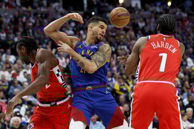 Michael Porter Jr. #1 of the Denver Nuggets battles for possession against Kawhi Leonard #2 and James Harden #1of the LA Clippers in Game One of the Western Conference First Round NBA Playoffs at Ball Arena on April 19, 2025 in Denver, Colorado.