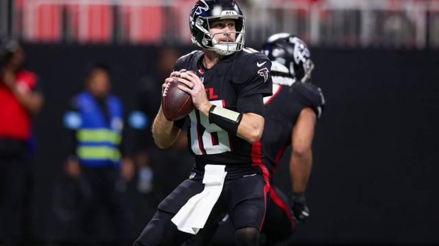 Dec 1, 2024; Atlanta, Georgia, USA; Atlanta Falcons quarterback Kirk Cousins (18) drops back to pass against the Los Angeles Chargers in the fourth quarter at Mercedes-Benz Stadium.  Brett Davis-Imagn Images