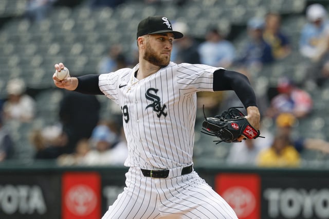 May 1, 2025; Chicago, Illinois, USA; Chicago White Sox starting pitcher Sean Burke (59) delivers a pitch against the Milwaukee Brewers during the first inning at Rate Field. Mandatory Credit: Kamil Krzaczynski-Imagn Images
