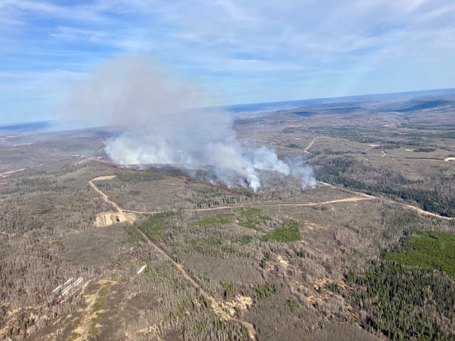 A wildfire burning in the Fish Creek Community Forest near Fort St. John.