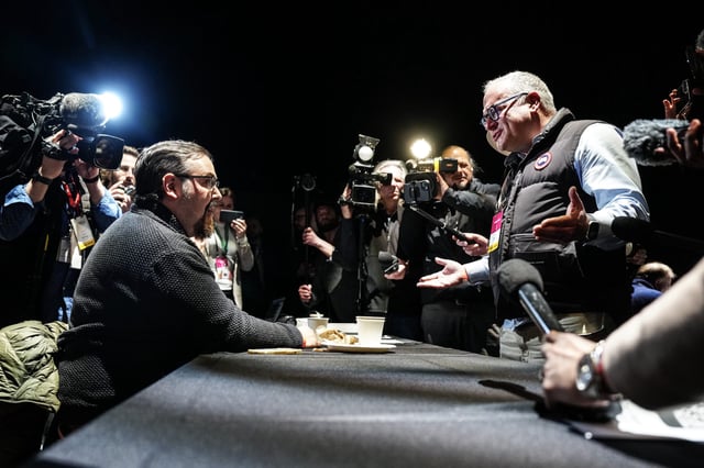 Ethan Cox (left) of Ricochet Media remonstrates with Ezra Levant, CEO of Rebel News, after the cancellation of Leader's scrums during the English-language federal election debate, in Montreal, on Thursday, April 17, 2025. THE CANADIAN PRESS/Chris Young