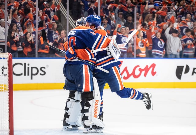 Edmonton Oilers goalie Calvin Pickard (30) and Connor Brown (28) celebrate the win over the Los Angeles Kings during NHL playoff action in Edmonton on Thursday, May 1, 2025.