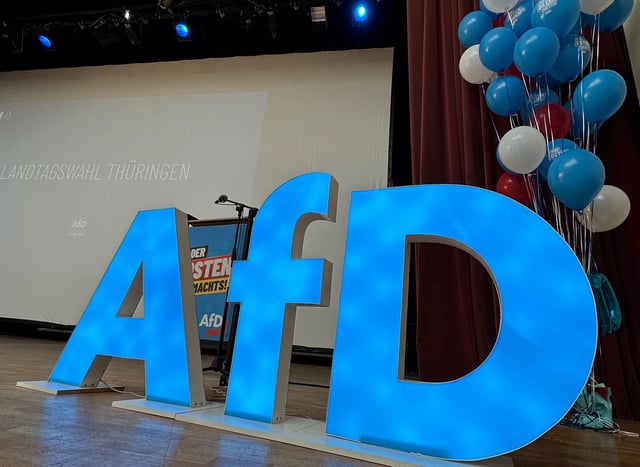 The AfD logo is pictured on stage before an election campaign rally of Bjoern Hoecke, leader of the Alternative for Germany in Thuringia, the state in east Germany where polls say his party could take 29% of the vote in September, in Arnstadt, Germany, July 20, 2024.     REUTERS/Thomas Escritt/File Photo