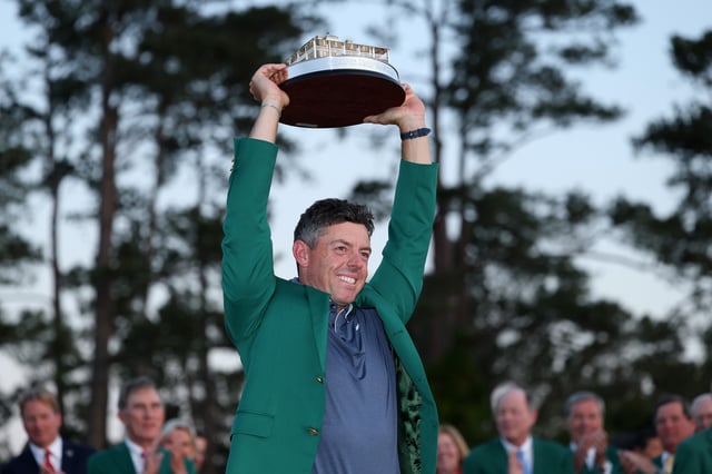 Rory McIlroy of Northern Ireland poses with the Masters trophy during the Green Jacket Ceremony after winning the 2025 Masters Tournament at Augusta National Golf Club on April 13, 2025 in Augusta, Georgia.
