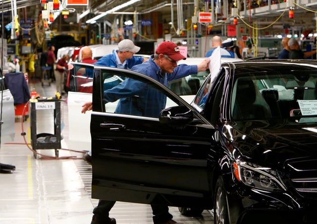 FILE- In this Feb. 14, 2017, file photo, employees do assembly and quality control work on automobiles at the Mercedes-Benz plant in Tuscaloosa, Ala. If a trade spat between the U.S. and China escalates and both countries raise tariffs, American automakers won’t suffer that much. But German luxury automakers BMW and Mercedes will. Mercedes ships up to 75,000 more from Tuscaloosa County. (Gary Cosby Jr./The Tuscaloosa News via AP, File)