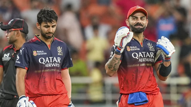 Virat Kohli, right, wants to get to know Jitesh Sharma better