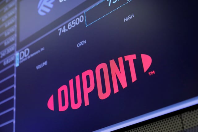 The logo for DuPont de Nemours, Inc. is seen on the trading floor at the New York Stock Exchange (NYSE) in Manhattan, New York City, U.S., August 3, 2021. REUTERS/Andrew Kelly