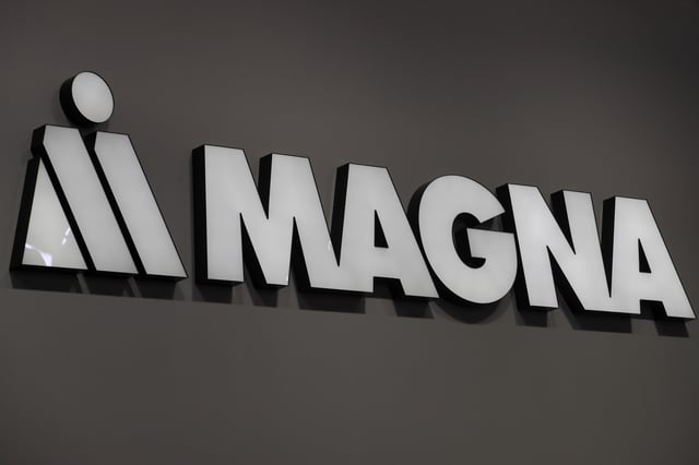 Magna logo is seen during Munich Auto Show, IAA Mobility 2021 in Munich, Germany, September 8, 2021. REUTERS/Wolfgang Rattay/File photo