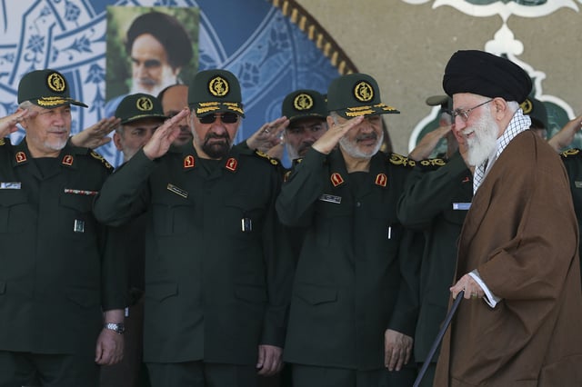 In this May 20, 2015 file photo, released by an official website of the office of the Iranian supreme leader, Gen. Hossein Salami, second right, salutes as Supreme Leader Ayatollah Ali Khamenei, right, arrives at a graduation ceremony of the Revolutionary Guard&#39;s officers in Tehran, Iran. Iran&#39;s supreme leader has appointed Salami to head to the country&#39;s powerful Revolutionary Guard, just after the U.S. designated the paramilitary force a terrorist group. Former commanders of the Revolutionary Guard Mohsen Rezaei, second left, and Yahya Rahim Safavi salute.