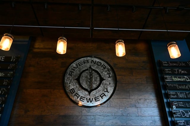 The beautiful tap room at River North Brewery on Nov. 7, 2022 in Denver. The popular brewery has two taprooms, one in RiNo on Blake street and the other, River North Brewery, located at 6021 North Washington Street. It is known for its barrel-aged beers along with fresh pilsners, IPAÕs, Belgian-inspired beers and their high ABV beers. Barrel aging beer is a centuries-old tradition born most out of necessity. In the modern craft era, it&#39;s a way to add woody character to bold styles like stouts or develop complexity in a nuanced style like a sour. The brewery uses whiskey, wine, tequila, sherry and rum barrels to age their beers. Malloy has been aging the Dark Sorceress for ten months and used 1500 pounds of malt and grain to produce only eight barrels of the finished beer. After a five-hour boil, Malloy said the porter took on huge chocolate, dark and roasty flavors while the Colorado Single Malt barrel added rich, smooth vanilla notes making it a well-rounded strong porter. The brewery says that Dark Sorceress is meant to be a sipping beer at 15.9% ABV and will be available on draft as well as in 375ml bottles for $18 at the taprooms while the limited small batch lasts. The brewery says that Òalthough no real spells will be cast on you, Dark Sorceress will present to you like magic.Ó  The brewery was opened by founder Matt Hess in 2012 who turned his  love of engineering and home brewing into the popular brewery that it is today.