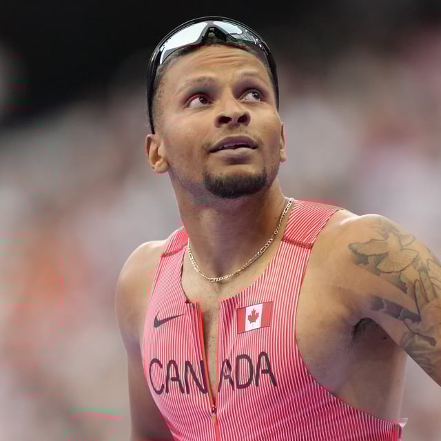 Andre De Grasse, of Canada, looks up at the clock after competing in the men's 100-metre semi-finals at the 2024 Paris Summer Olympics, Sunday, Aug. 4, 2024, in Saint-Denis, France. THE CANADIAN PRESS/Nathan Denette
