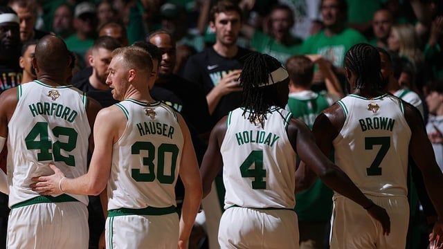 BOSTON, MA – JUNE 6: Al Horford #42, Sam Hauser #30, Jrue Holiday #4 and Jaylen Brown #7 of the Boston Celtics look on during the game against the Dallas Mavericks during Game 1 of the 2024 NBA Finals on June 6, 2024 at the TD Garden in Boston, Massachusetts. NOTE TO USER: User expressly acknowledges and agrees that, by downloading and or using this photograph, User is consenting to the terms and conditions of the Getty Images License Agreement. Mandatory Copyright Notice: Copyright 2024 NBAE  (Photo by Garrett Ellwood/NBAE via Getty Images)