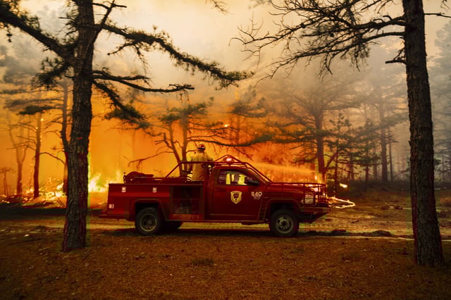 Firefighters battle a wildfire in Ocean County, N.J. on April 24.