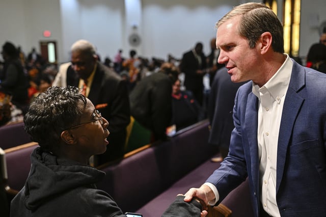 Kentucky Gov. Andy Beshear, right, speaks with an attendee during the annual Black History Month event, Lift Every Voice, presented by Women in Worship of Lexington at Consolidated Baptist Church in Lexington, Ky., Sunday, Feb. 23, 2025.