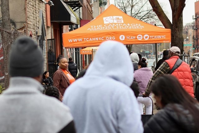 People line up for groceries outside The Campaign Against Hunger's distribution center in the Brooklyn borough of New York on April 15.
