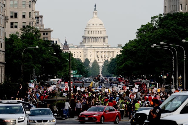 People gather for a May Day demonstration near the US Capitol in Washington, DC, on May 1.