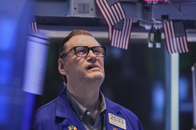 Specialist Patrick King works on the floor of the New York Stock Exchange, Friday, May 2, 2025. (AP Photo/Richard Drew)