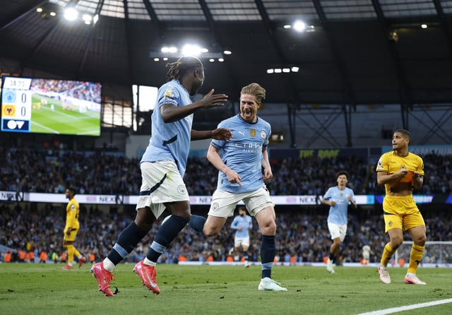 Soccer Football - Premier League - Manchester City v Wolverhampton Wanderers - Etihad Stadium, Manchester, Britain - May 2, 2025 Manchester City's Kevin De Bruyne celebrates scoring their first goal with Manchester City's Jeremy Doku Action Images via Reuters/Jason Cairnduff EDITORIAL USE ONLY. NO USE WITH UNAUTHORIZED AUDIO, VIDEO, DATA, FIXTURE LISTS, CLUB/LEAGUE LOGOS OR 'LIVE' SERVICES. ONLINE IN-MATCH USE LIMITED TO 120 IMAGES, NO VIDEO EMULATION. NO USE IN BETTING, GAMES OR SINGLE CLUB/LEAGUE/PLAYER PUBLICATIONS. PLEASE CONTACT YOUR ACCOUNT REPRESENTATIVE FOR FURTHER DETAILS..