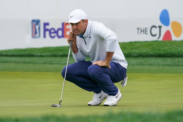 May 2, 2025; McKinney, Texas, USA; Scottie Scheffler lines up a putt on the 18th green during the second round of the THE CJ CUP Byron Nelson golf tournament. Mandatory Credit: Raymond Carlin III-Imagn Images