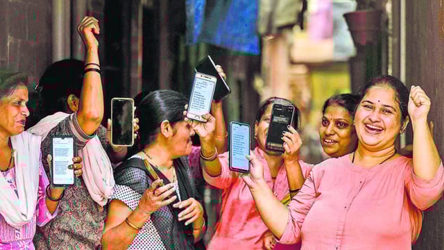 Mumbai, India - Aug. 16, 2024: Women expressing their happiness over the deposit of ?3000 in women's accounts under the Maharashtra Government's Ladki Bahin Yojana in Mumbai, India, on Friday, August 16, 2024. (Photo by Satish Bate/ Hindustan Times) (Hindustan Times)