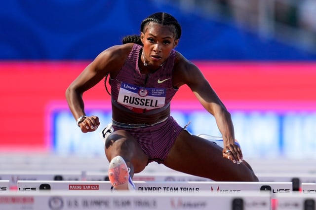 Masai Russell, show during the 2024 U.S. Olympic Trials, set the American record in the 100-meter hurdles Friday, and ran the second fastest time in history in the event. (AP Photo/George Walker IV)
