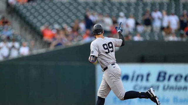 Apr 30, 2025; Baltimore, Maryland, USA; New York Yankees outfielder Aaron Judge (99) hits a home run during the first inning against the Baltimore Orioles at Oriole Park at Camden Yards.