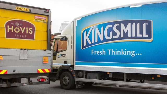 Will two become one? Lorries deliver the competing bread brands in Fleetwood, Lancashire